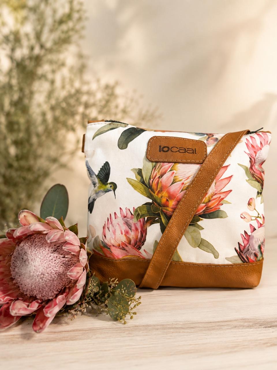 Marli sling bag with leather bottom and sling with canvas print