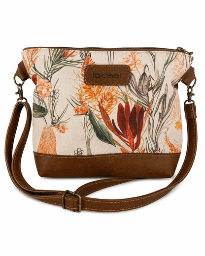Marli sling bag with leather bottom and sling with canvas print