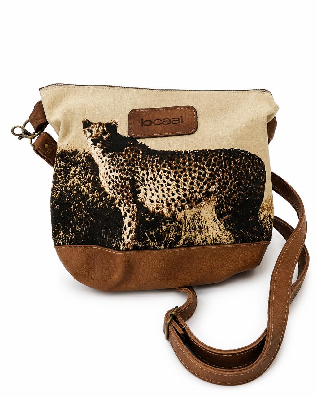 Marli sling bag with leather bottom and sling with canvas print