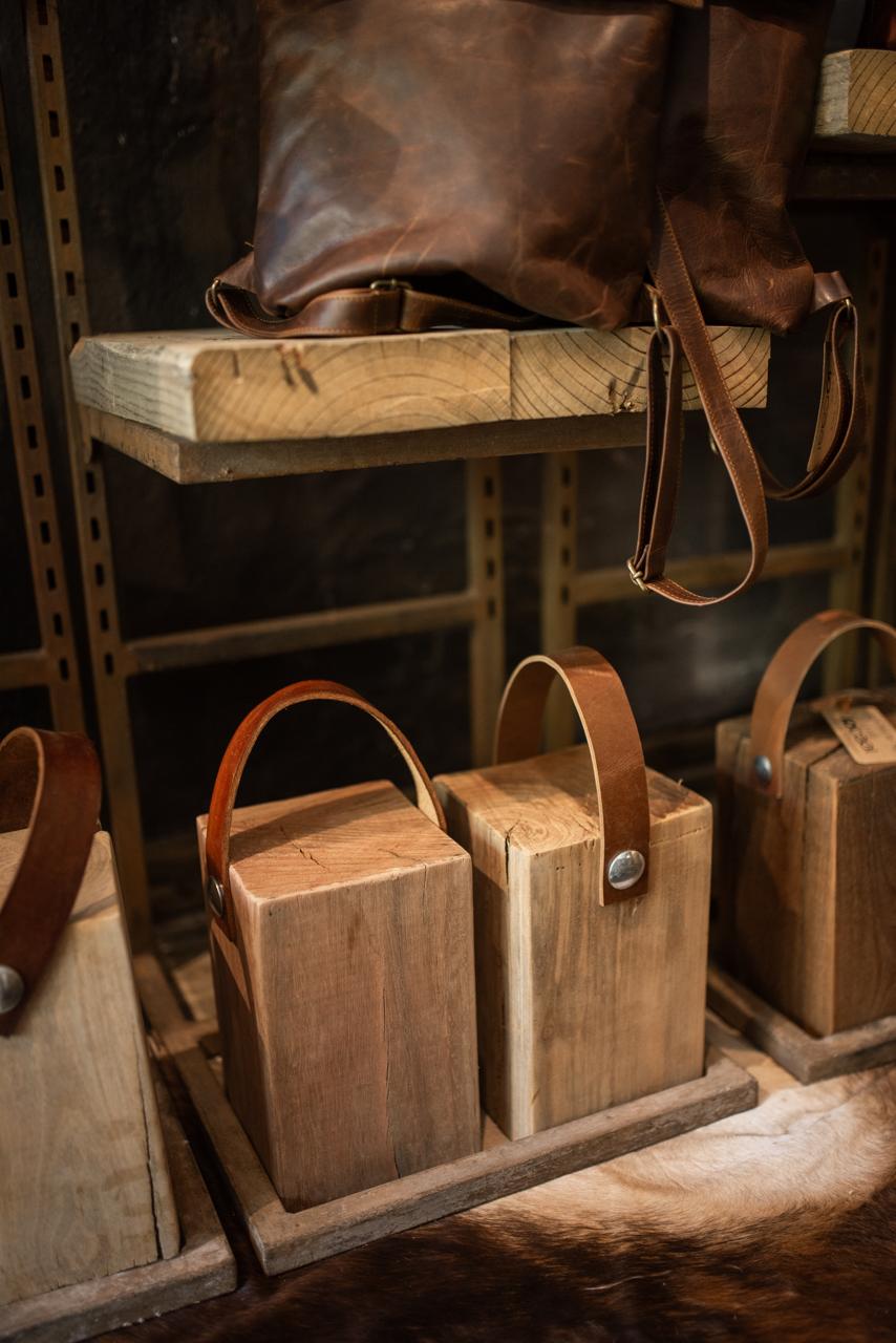 Wooden block Doorstoppers with leather straps.